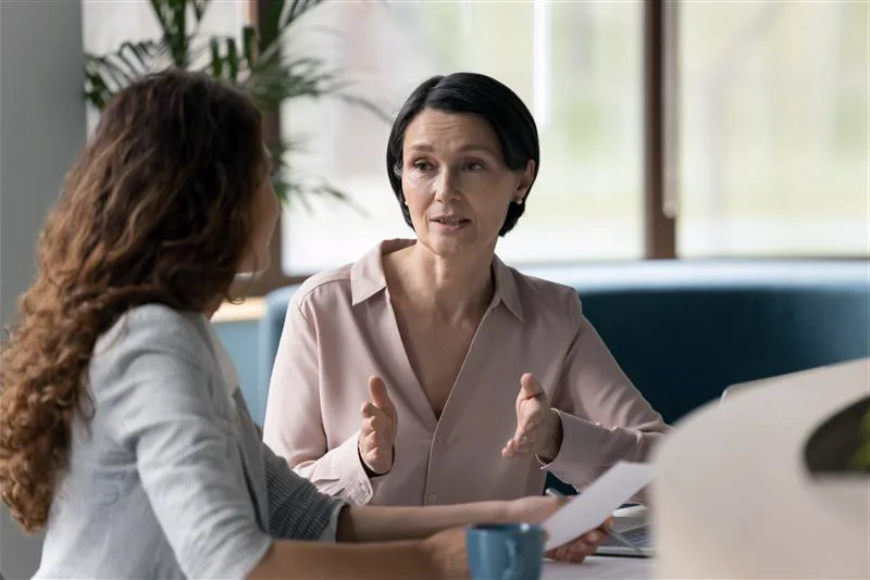 Professional women talking together